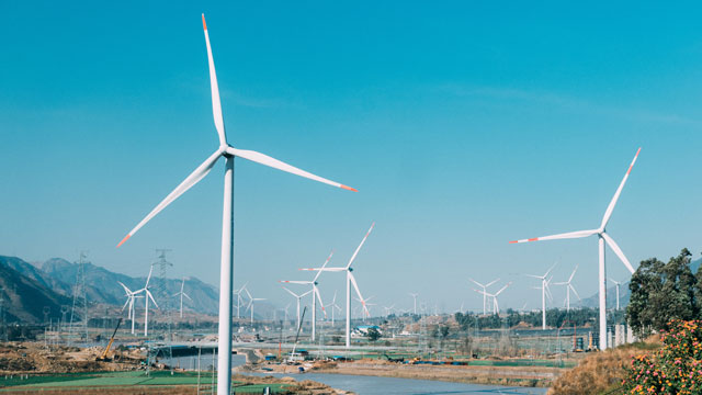 Panoramic view of wind turbines on the ocean